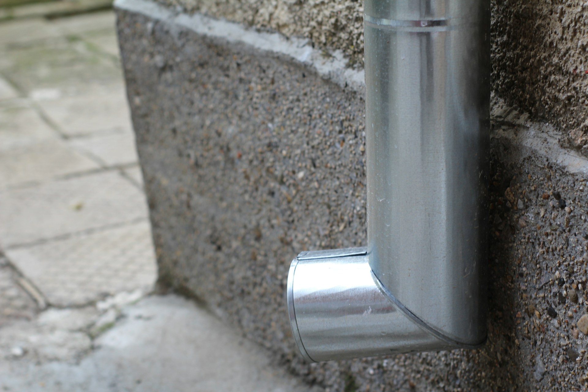 Using a Concrete Splash Block to Direct Rain Away Properly