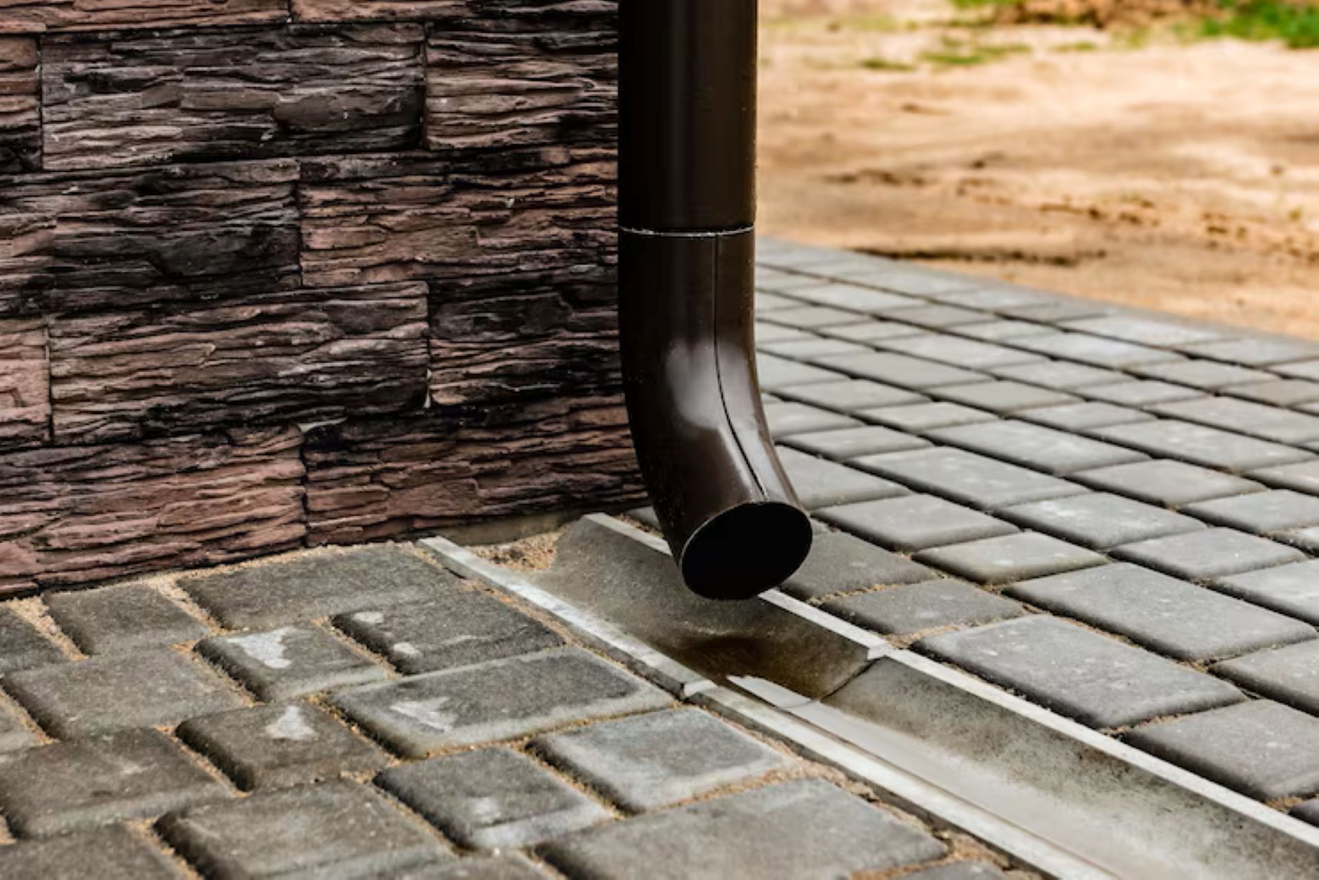 How a Concrete Splash Block Helps Keep Garden Beds Dry